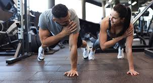 Toning Bingo Wings: Your Ultimate Guide to Sculpting Sleek Arms at the Gym 3 Fitness trainer demonstrating arm toning exercises Bellshill