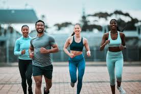 Sculpting Sleek Arms: The Essential Role of Cardio in Toning Without Bulking Up 3 image of people running to incorporate cardio Bellshill exercise into their life to help tone arms and body.